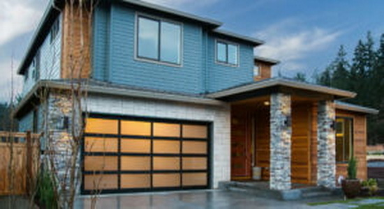 <strong>Hörmann - Modern Classic™ 7500</strong> <br><br> Now you can have the stylish appeal of a sleek and architecturally refined garage door, the Modern Classic™. The Modern Classic is a true stile-and-rail garage door made with an all-aluminum construction. Panel widths and heights can be configured to meet your requirements. Choose from glass or aluminum panels and painted, anodized or wood grain powder coated finishes. Regardless of your choices, the Modern Classic’s beauty will last a lifetime and is virtually maintenance free.