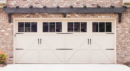 <strong>Wayne Dalton - Carriage House Steel Garage Doors 9700</strong> <br><br> Wayne Dalton's steel garage door Model 9700 is stylish and versatile, offering a variety of carriage house designs, large windows and a wide range of colors and stain options. These carriage house garage doors offer embossed, high tensile steel panels that give the look of wood with the strength of steel. Model 9700 comes with foamed-in-place polyurethane insulation with an R-value of 10*, which can improve your home’s thermal efficiency, block street noise and make the door operate more quietly. This door also offers wind load options, pinch-resistant panels and the TorqueMaster® Plus, our exclusive counterbalance system that safely contains springs inside a steel tube.